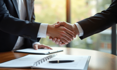 Deux professionnels scellent un accord juridique dans un bureau lumineux